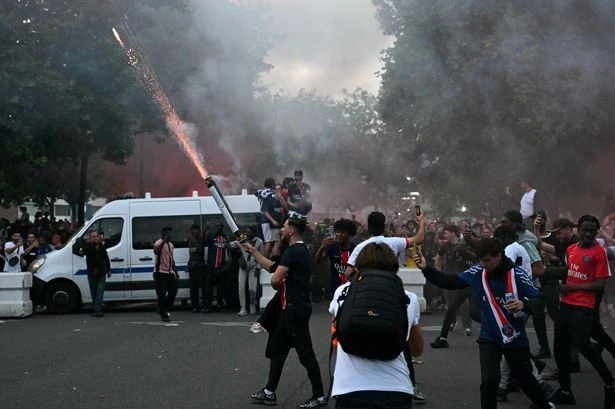 Paris Saint Germain fans riot near ground as fires set and missiles thrown at police