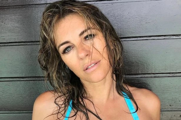 Liz Hurley slips soaking wet curves into plunging bikini for sultry selfies