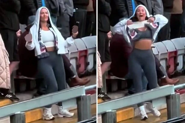 Female football fan lifts up top and gives rivals eyeful after 'slapper' taunts