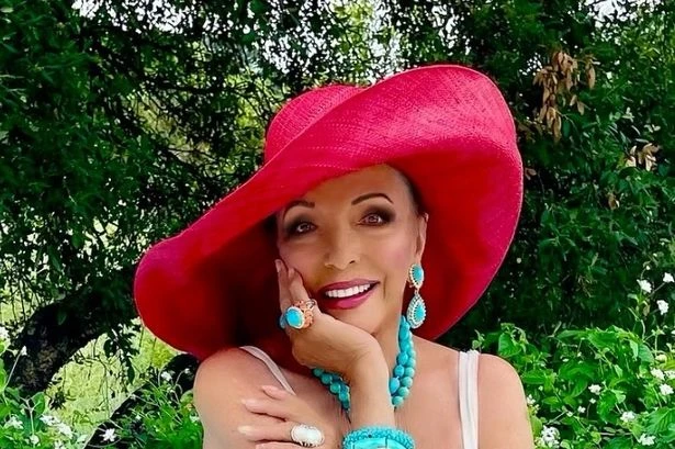 Joan Collins, 92, looks sensational in white swimsuit for age-defying snap