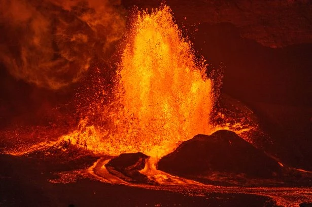 Moment Hawaii volcano spews lava 600ft in the air as 'golden glass' rains down