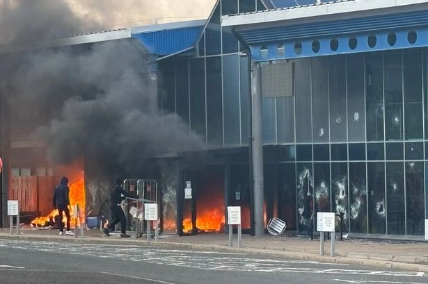 Riot police at leisure centre blaze after 'masked thug's' cause disorder in UK town