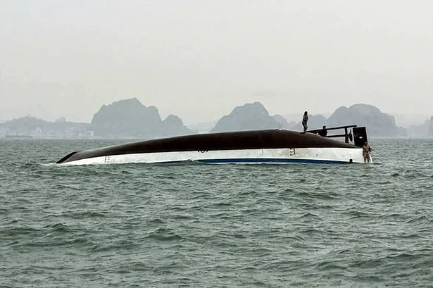Vietnam tourist boat capsizes during thunderstorm leaving 18 dead including children