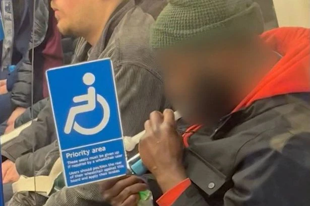 Shocking moment man openly smokes 'crack pipe' in packed London Underground carriage