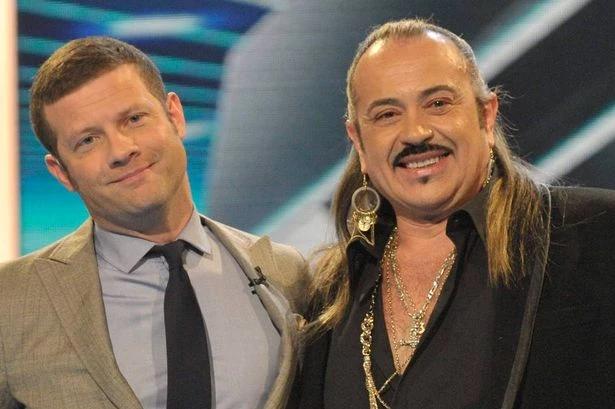 X Factor's Wagner flashes buff physique and tattoos after wild makeover at 69