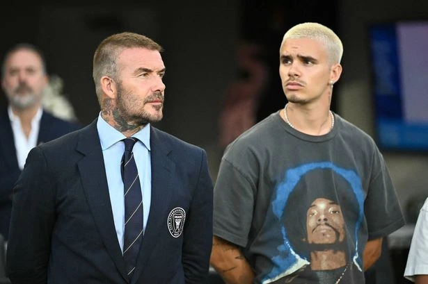 David Beckham and son look tense after family feud with Brooklyn escalates