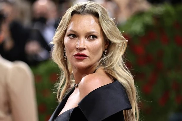 Kate Moss 'back to her old partying ways' as she 'necks lager backstage at festival'