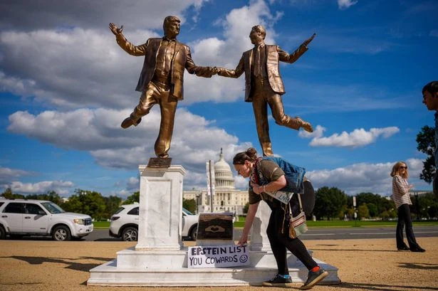 Iconic Trump-Epstein friendship statue reinstated after being toppled by supporters