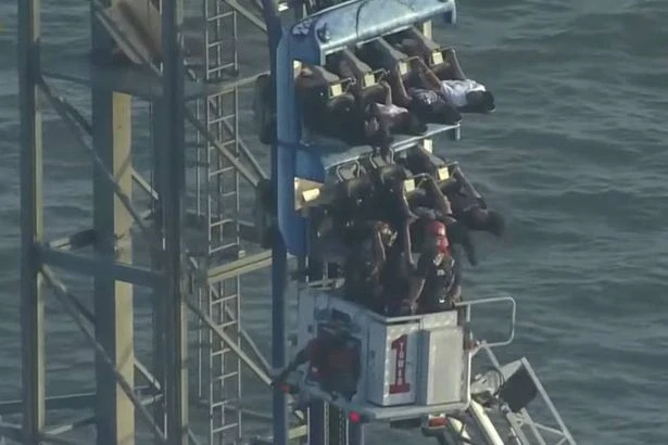 Riders left dangling mid-air after rollercoaster breaks down during 90-degree drop