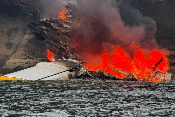 Plane crash lands into fireball on secluded island as passengers miraculously survive