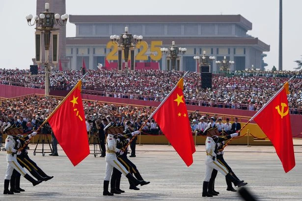 China shows off new missiles, drones and fighter jets in massive military parade