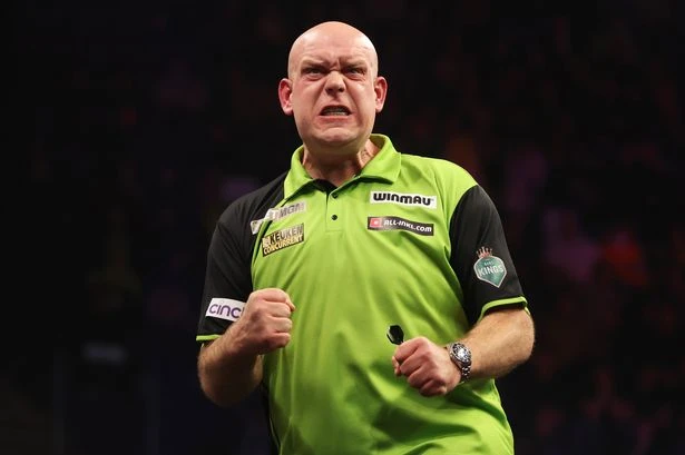 Michael van Gerwen had to be 'held back' after 'throwing darts rival over table'