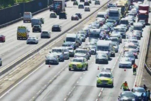 Bank Holiday chaos as M1 closes after crash with sweaty drivers escaping boiling cars
