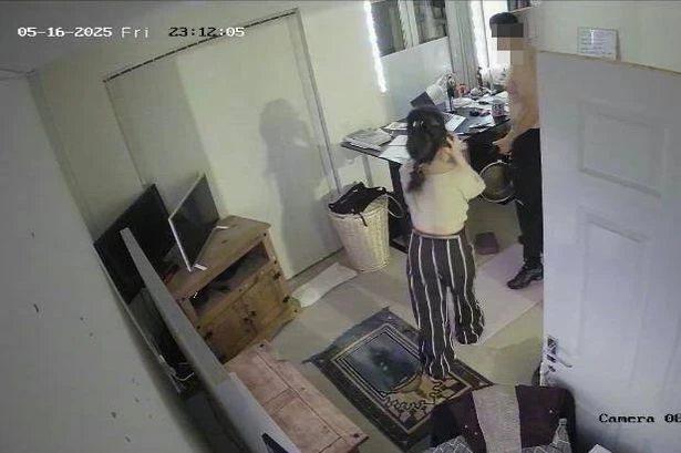 Terrifying moment man climbs through woman's kitchen window with knife