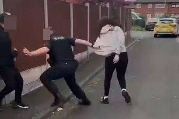 Shocking moment group of teenagers surround lone police officer in chaotic brawl