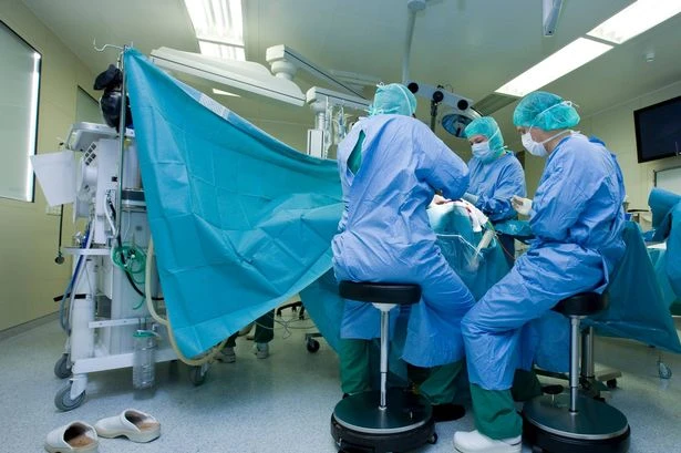 Brain surgeon arrested after 'letting daughter, 12, drill into patient's skull'