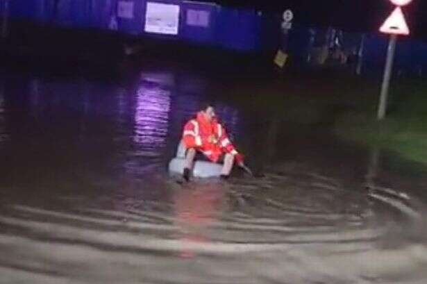 Bloke goes for a row in inflatable chair on flooded street - 'It was just a bit of fun'