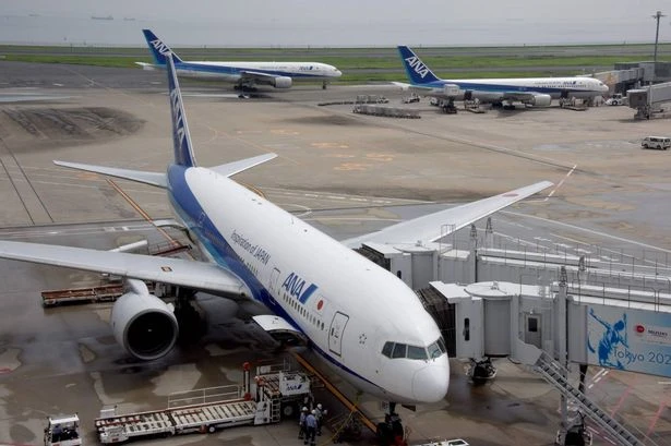 Man 'tries to open emergency exit' mid-air on passenger jet full of holidaymakers