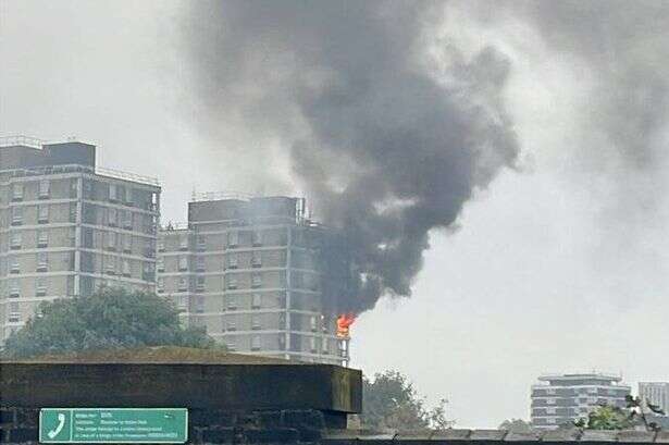 Huge blaze as 70 firefighters rush to tackle flames and smoke billowing from block