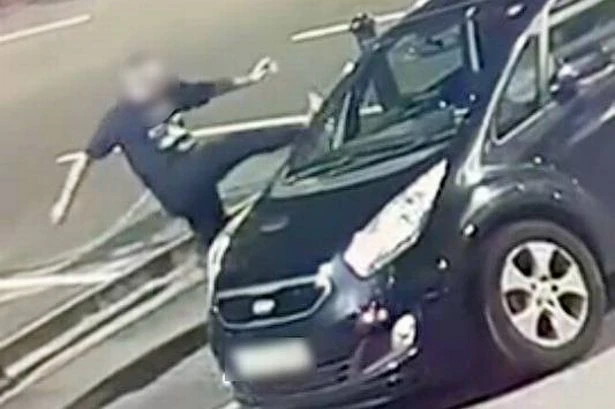 Shocking moment stranger attacks woman's car in Birmingham street 'for the fun of it'