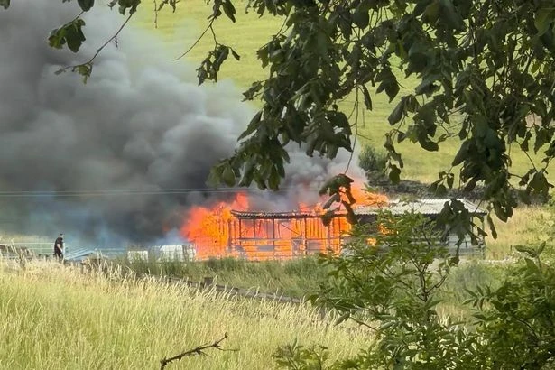 Murder probe launched after woman found dead in barn blaze as man arrested