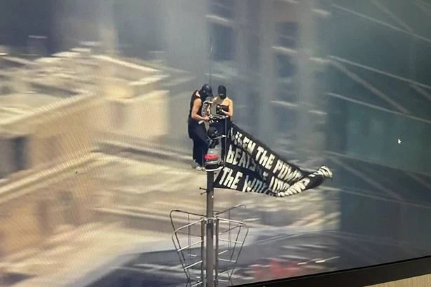 Masked couple scale Empire State Building for wedding proposal as pair taken into custody