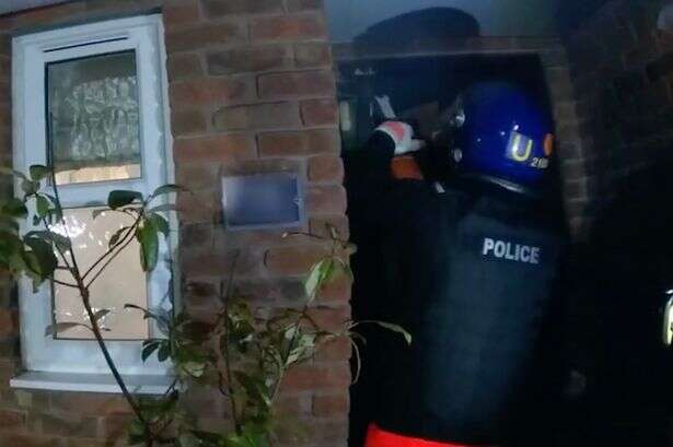 Moment cops use chainsaw to smash into home of gang behind 'cash machine raids'