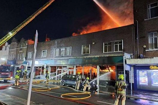 Huge fire rips through Poundland shop as 100 firefighters rush to tackle blaze