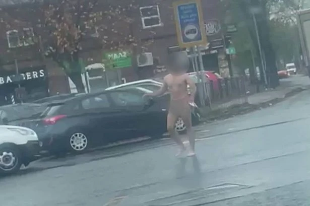 Naked man attacks motorists and tries to pull driver from van in terrifying footage