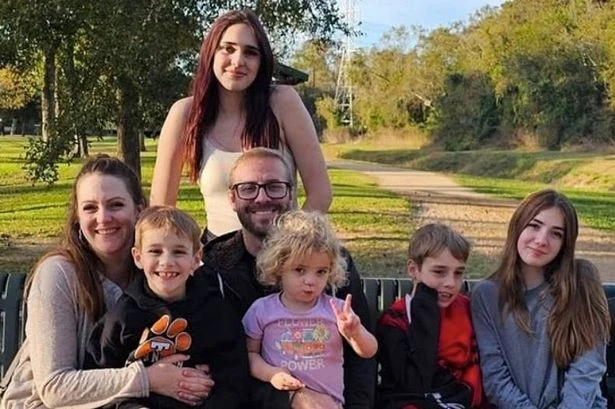 Police car hits family minivan leaving two young boys dead and sisters critical