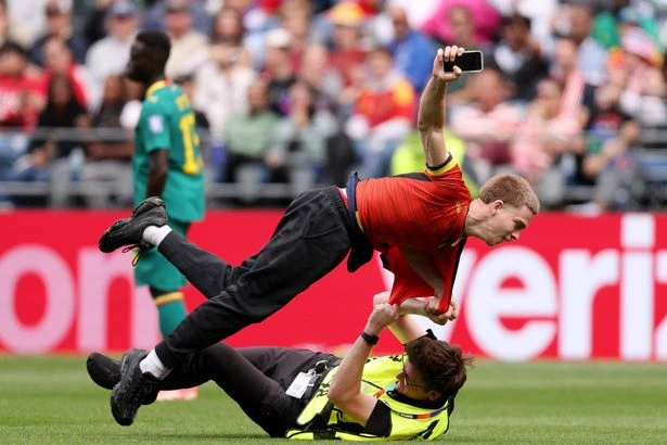 World Cup match stopped as three protesters wrestled and removed from pitch