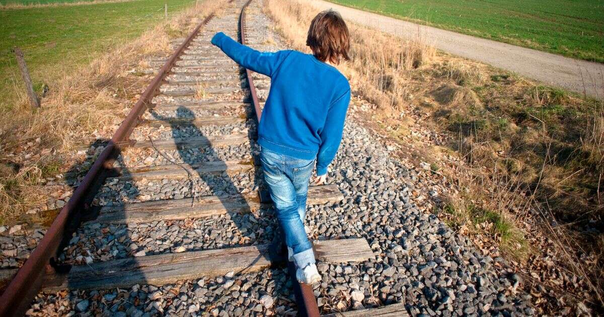 Urgent police warning after children caught 'playing chicken' on railway nearly struck by train