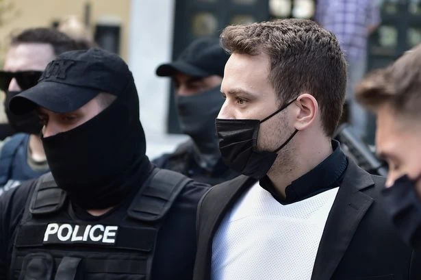 Caroline Crouch's Greek husband arrives at court as crowds chant 'rot in hell'