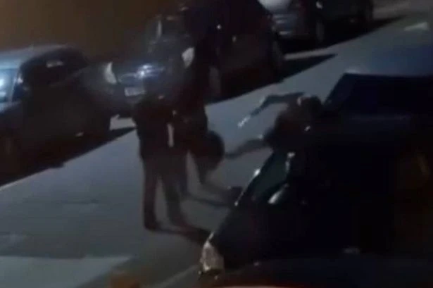 Moment woman allegedly swings knife at man in Birmingham street