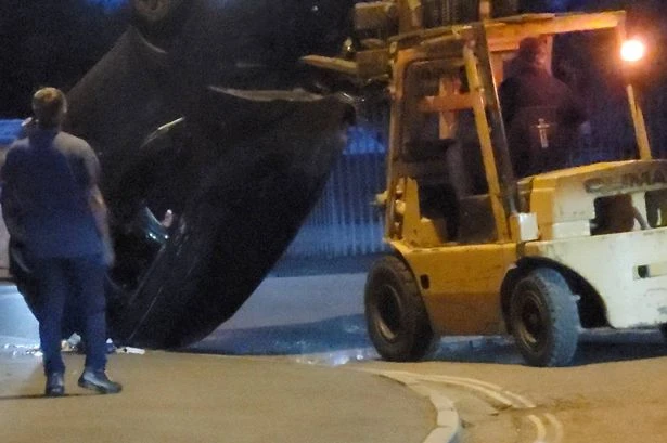 Forklift driver 'lifts cars with people inside' in rampage that leaves vehicles flipped