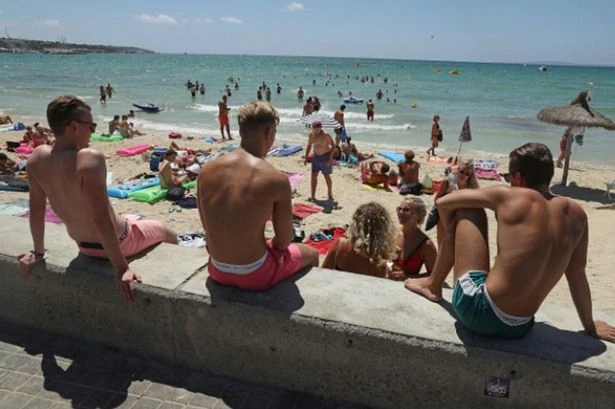 Spain issues warning to UK tourists over 'washing sand off feet' at beach