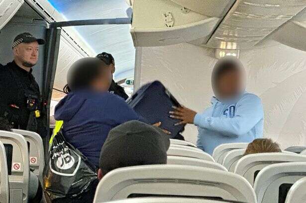 Armed police arrest seven for causing chaos on TUI flight