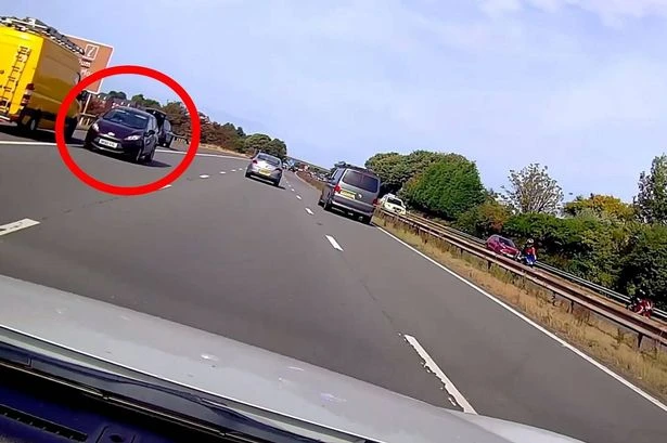 Horrifying moment car driver filmed hurtling wrong way down motorway