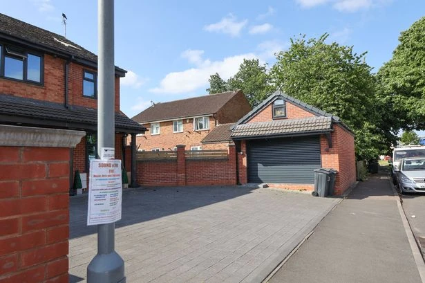 Man who built house instead of garage finally relents after six-year battle
