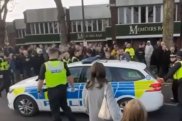 Man charged with religiously aggravated offence after unrest at Remembrance parade