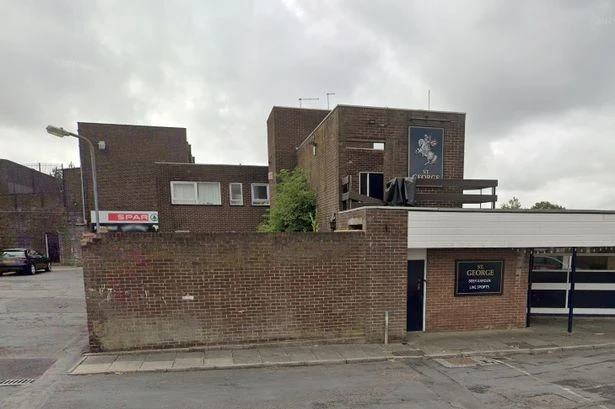 Offensive graffiti covering area of Midlands town as it appears on pub, takeaway and bridges