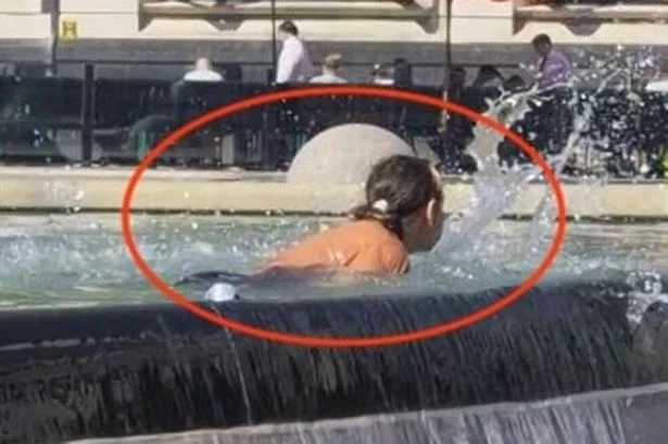 Real-life addition to floozie fountain as woman takes a dip in 32C heat