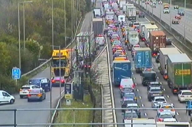Midlands motorway closed in both directions after car crashes off bridge