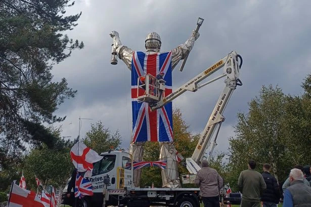 Massive Union Jack draped from roundabout statue that has become centre of 'war on flags'