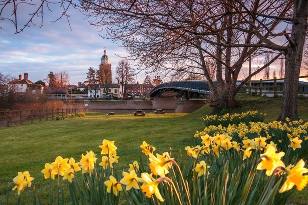 The 'serene' riverside town with a population of less than 3,000 that thousands flock to every summer