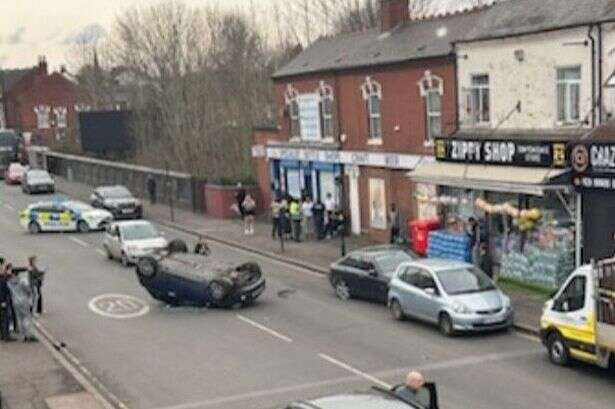 Pershore Road crash - man taken to hospital as Mini flips after hitting parked car