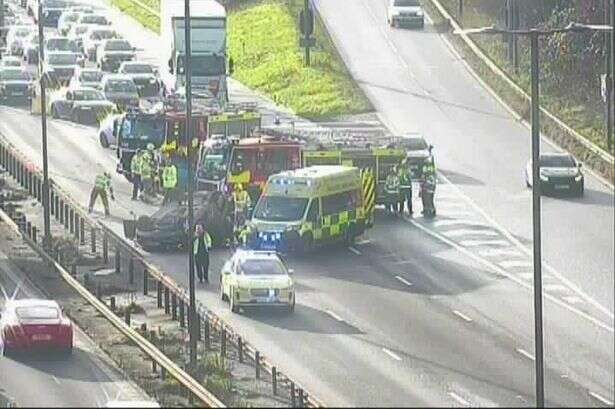 M5 closed after car flips near major slip road