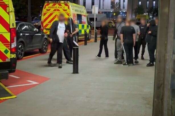 Shocking moment threatening mob force Queen Elizabeth Hospital into lockdown