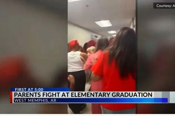 Children scream 'stop' as primary school graduation turns into brawl between parents