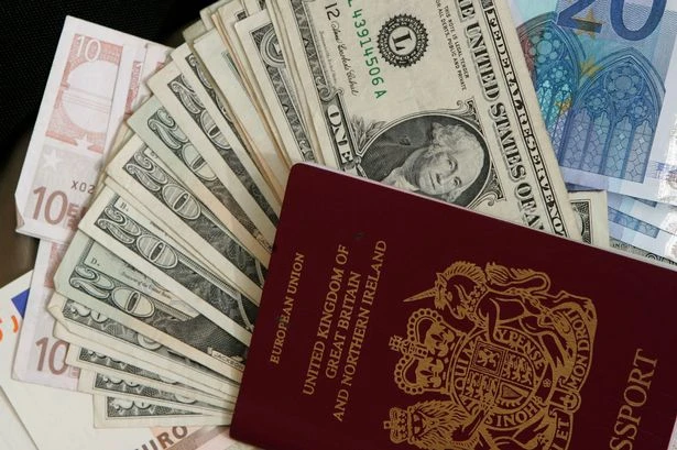 UK tourists who hold passports face new £95 charge which has been branded a 'joke'